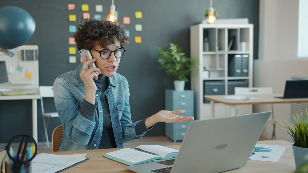 Business owner on the phone at her desk